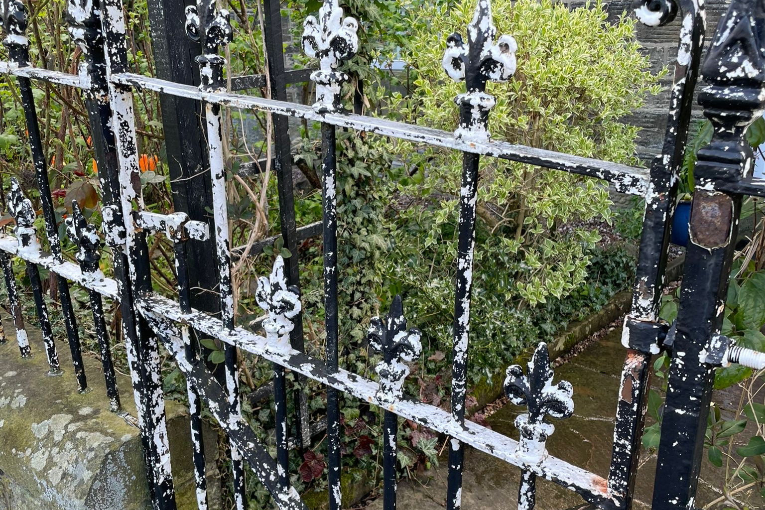 Traditional wrought iron railings before restoration