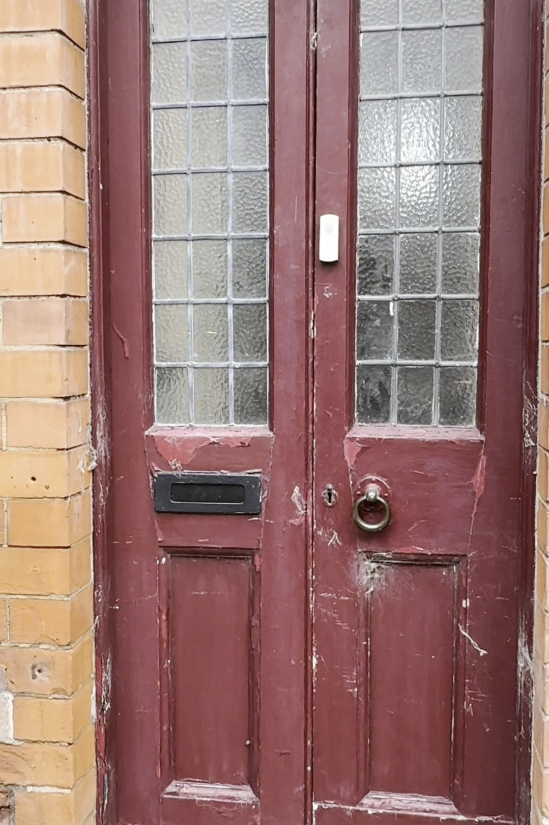 Old painted wooden door before stripping