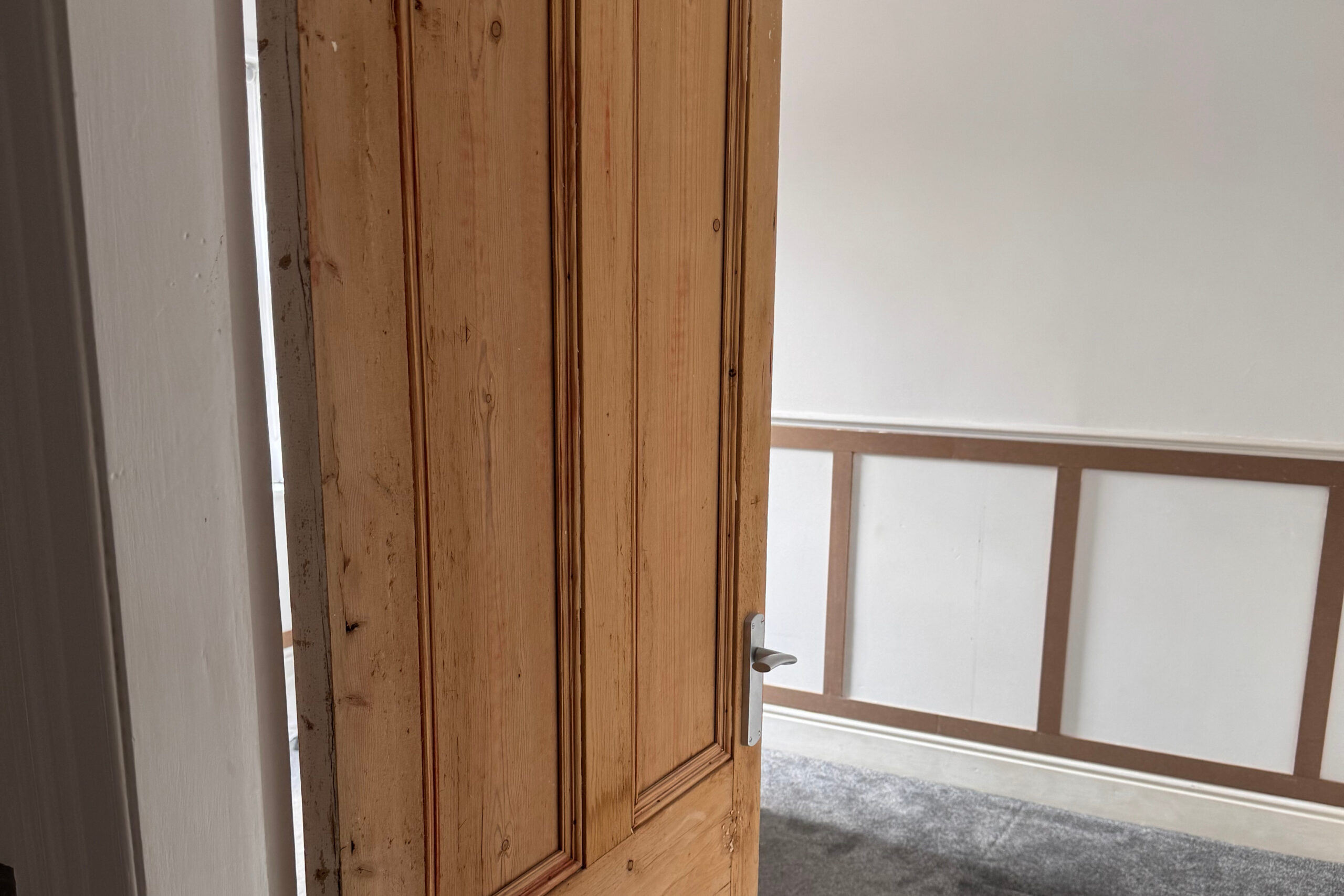 Sanded pine door after stripping