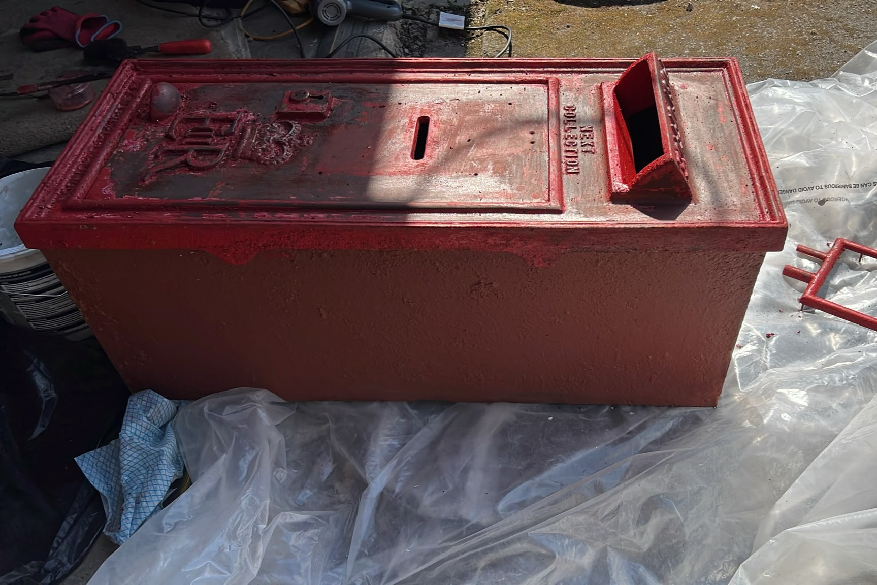 W T Allen cast iron post box during paint and enamel stripping